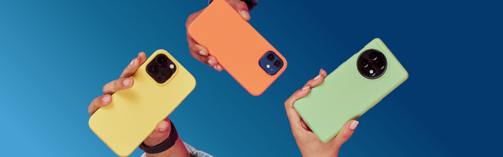 Hands holding phones on a blue background